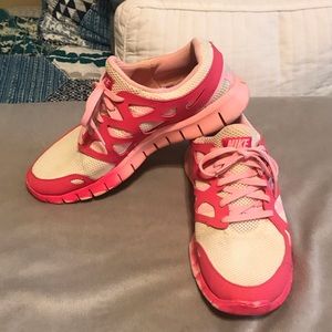 Pink and white Nike Running Shoes